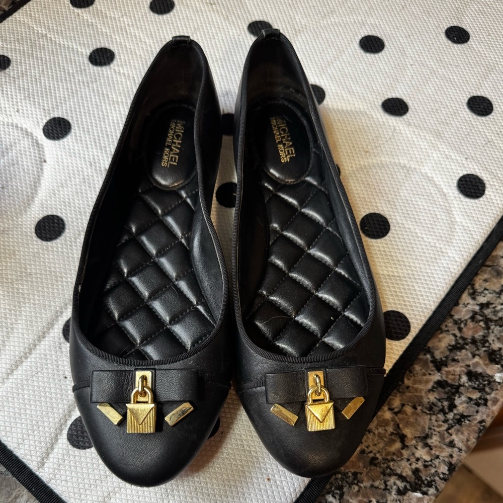 Michael Kors black Alice ballet flats with gold accent